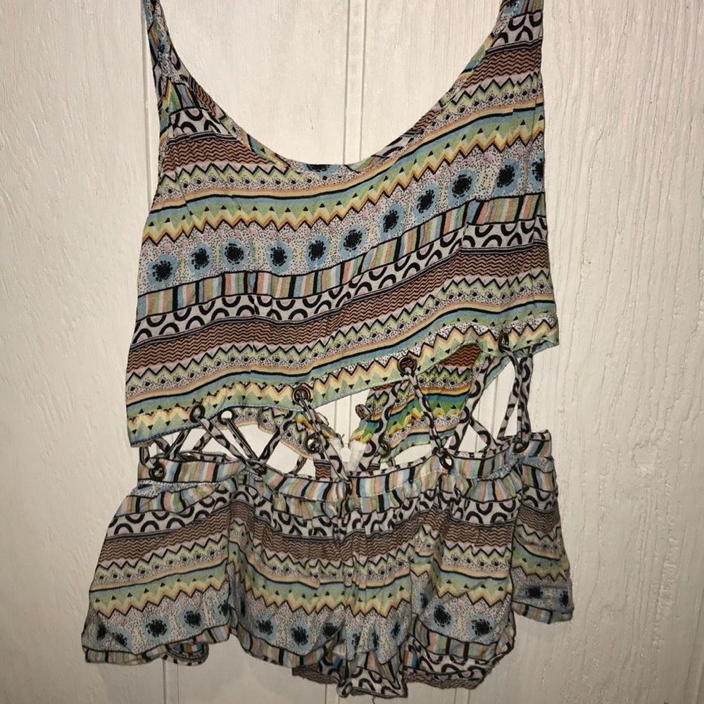 LF brand tank top with tribal design and cut outs